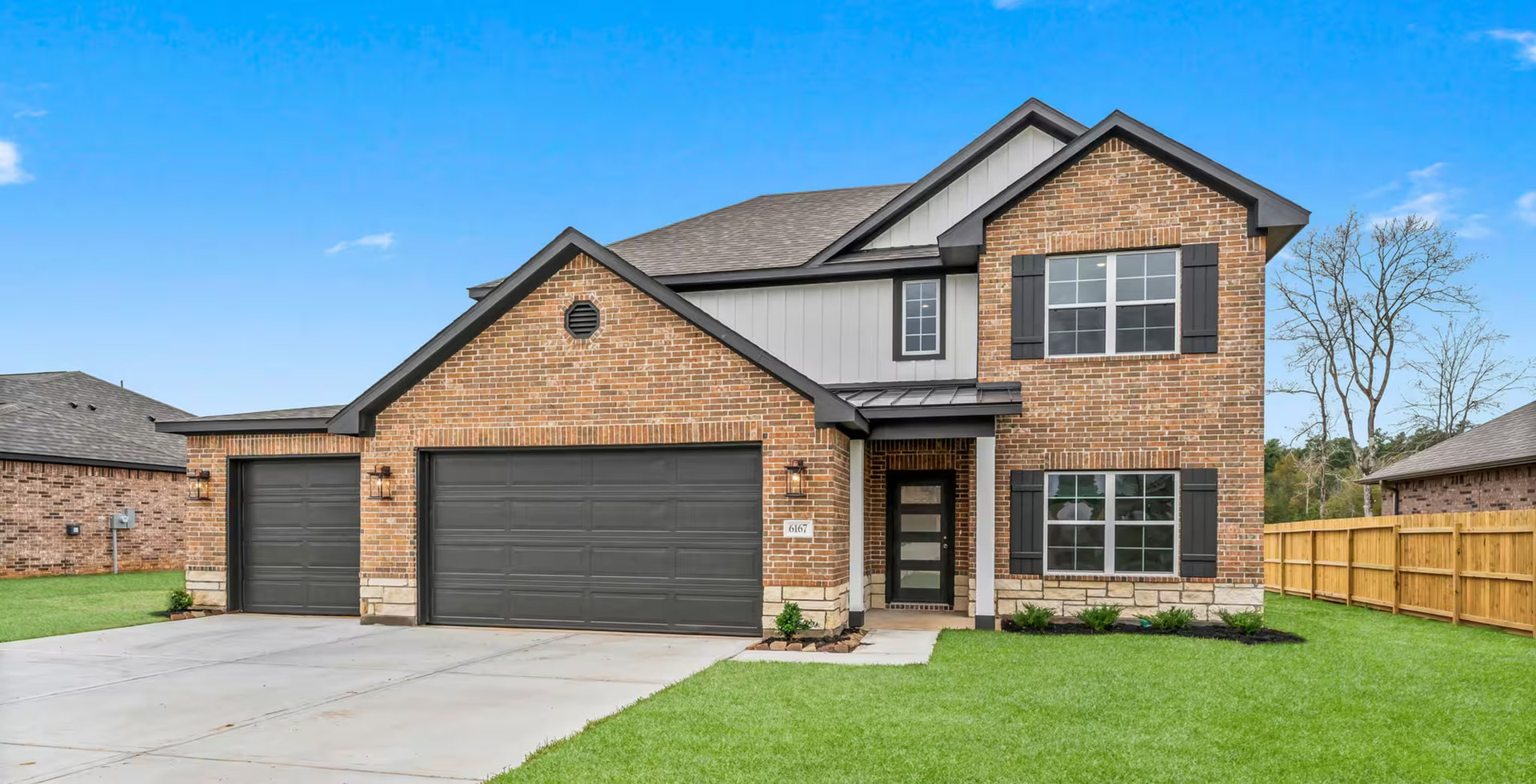 country style home with 3 car garage